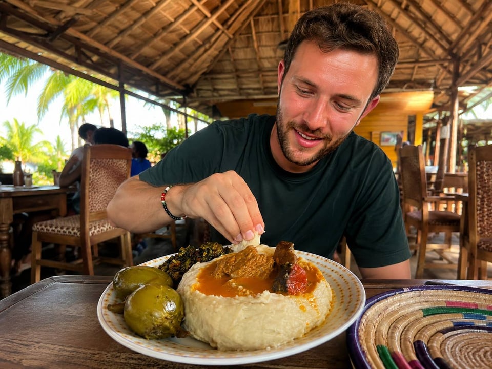 A Man Tasting Achu Using His Hands