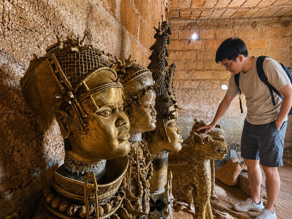 A Tourist Exploring Cameroonian Bronze Sculptures